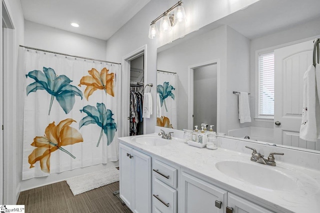 bathroom with vanity and separate shower and tub