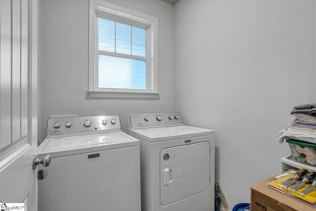 clothes washing area with washer and dryer