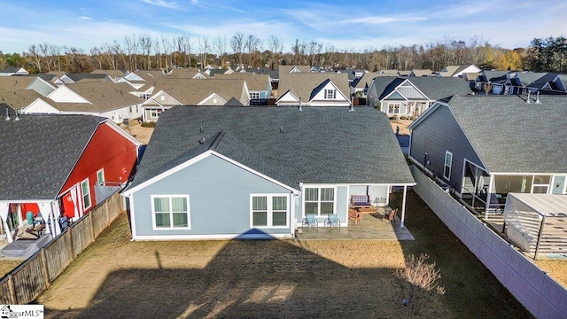 rear view of house with a patio