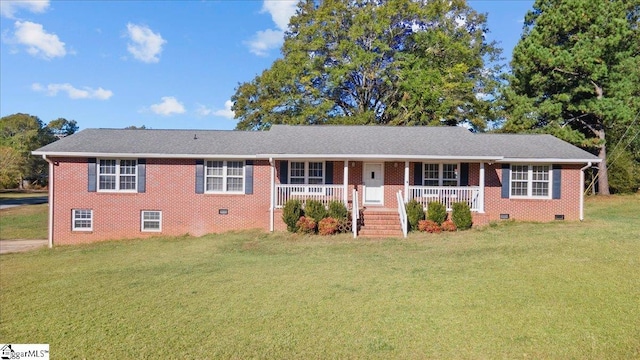 ranch-style home featuring a porch and a front lawn