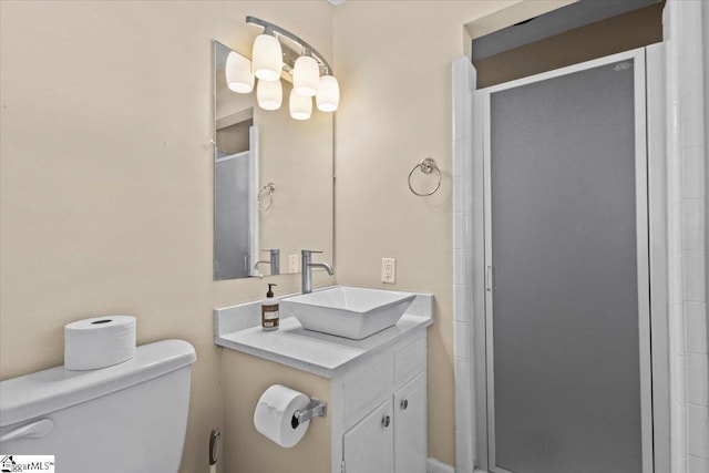 bathroom with vanity, an enclosed shower, and toilet