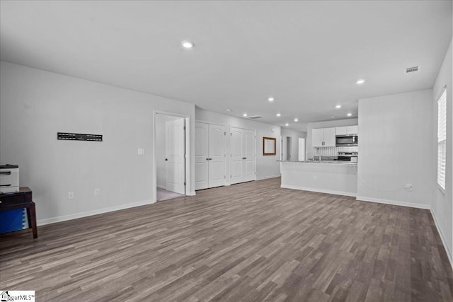 unfurnished living room featuring light hardwood / wood-style floors