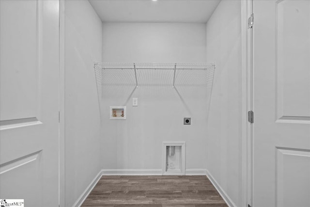 clothes washing area featuring hookup for an electric dryer, dark wood-type flooring, and hookup for a washing machine