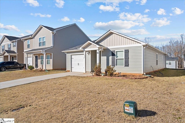 view of front of property with a garage and a front lawn