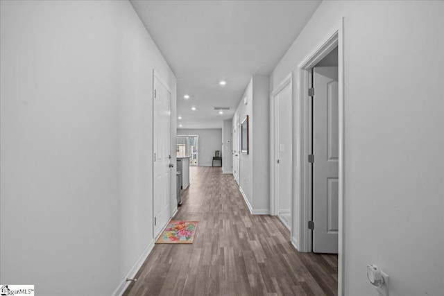 hallway featuring dark hardwood / wood-style floors