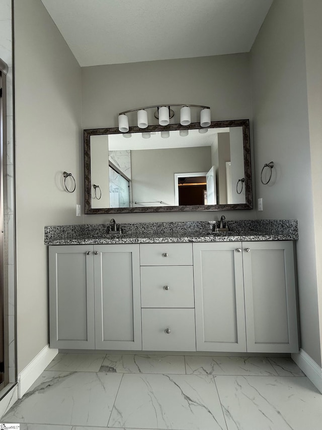 bathroom featuring vanity and vaulted ceiling