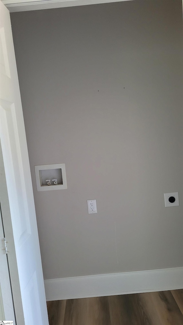 washroom with hookup for an electric dryer, hookup for a washing machine, and wood-type flooring