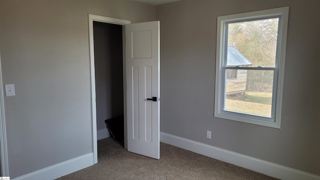 unfurnished bedroom featuring carpet