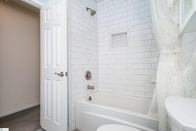 bathroom with toilet and shower / tub combo