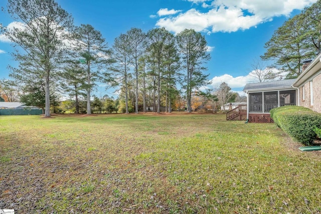 view of yard featuring a sunroom