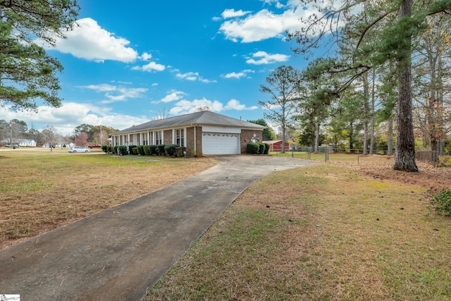 ranch-style house featuring a front lawn, a porch, and a garage