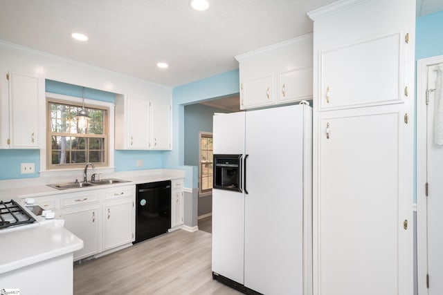 kitchen with white cabinets, sink, white refrigerator with ice dispenser, dishwasher, and light hardwood / wood-style floors