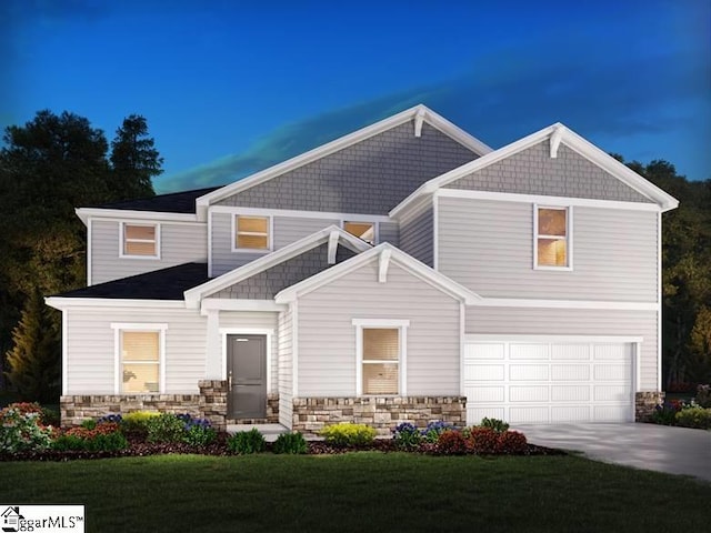 craftsman house featuring a lawn and a garage