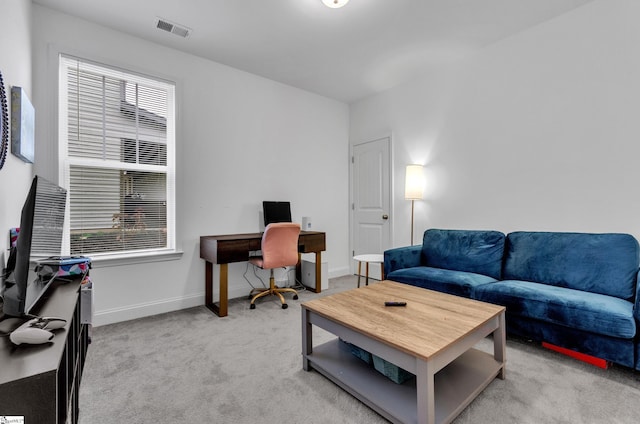 living room featuring light carpet