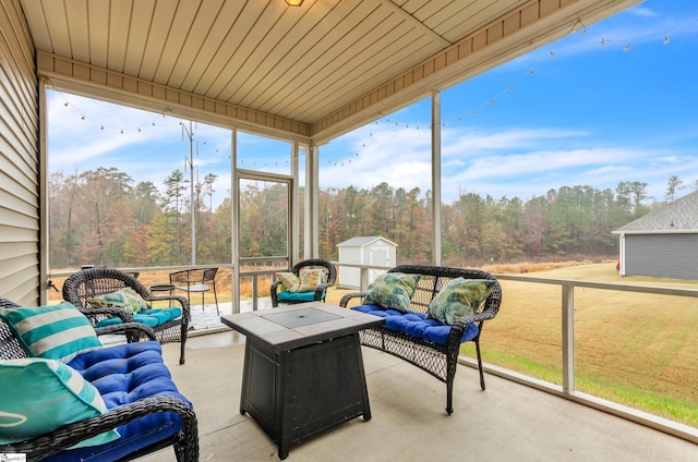 sunroom / solarium featuring wood ceiling