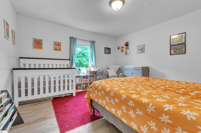 bedroom with hardwood / wood-style floors