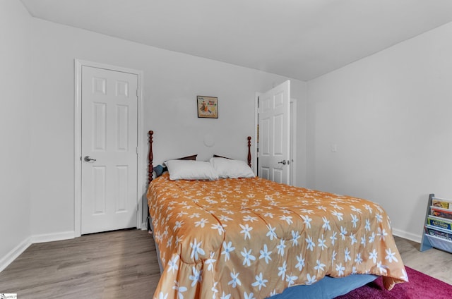 bedroom featuring wood-type flooring