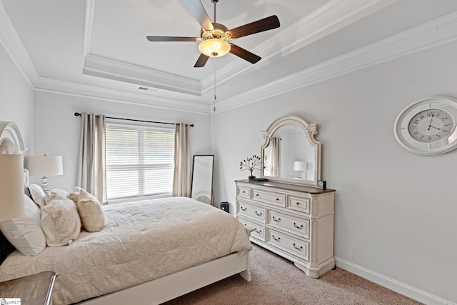 bedroom with ceiling fan, a raised ceiling, ornamental molding, and light carpet