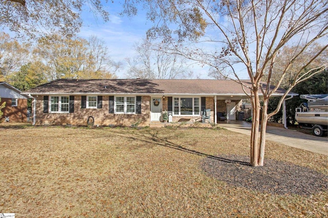 ranch-style home with a front lawn and a carport