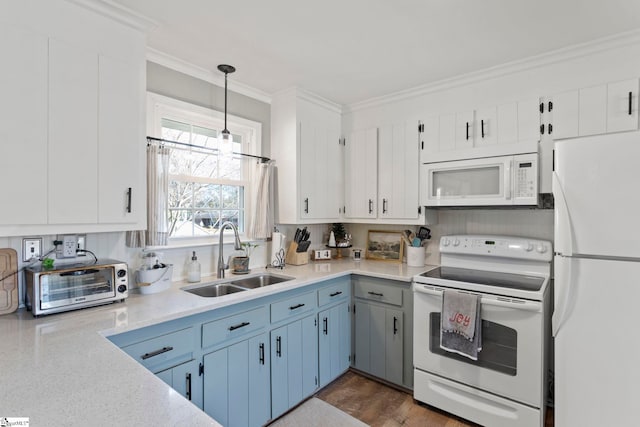 kitchen with white cabinets, sink, white appliances, and hanging light fixtures