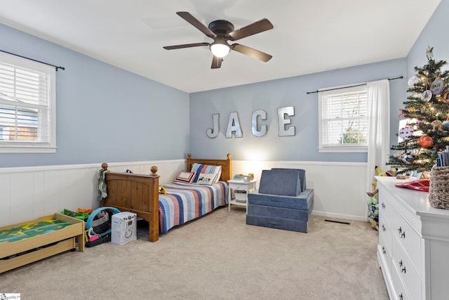 carpeted bedroom featuring ceiling fan