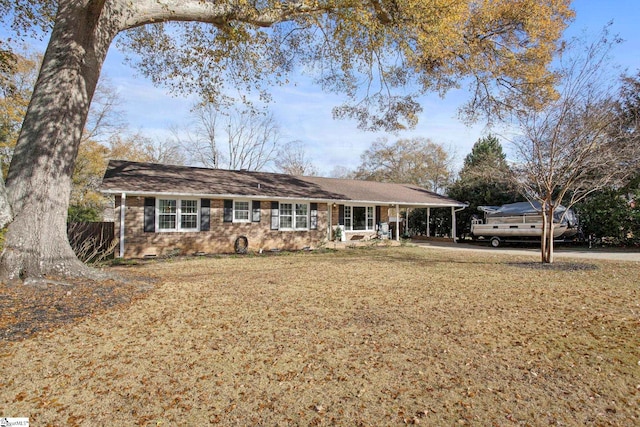 ranch-style house with a carport