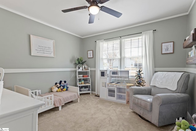 living area with light carpet, ceiling fan, and ornamental molding