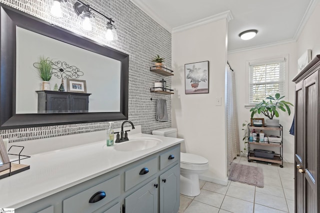 bathroom with tile patterned flooring, vanity, toilet, and crown molding