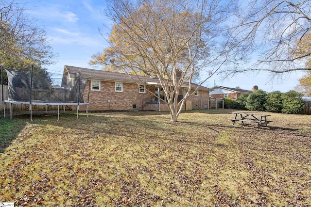 view of yard with a trampoline