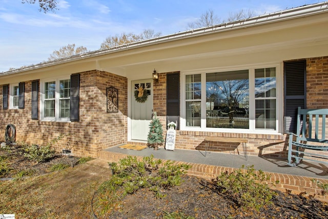 property entrance with covered porch