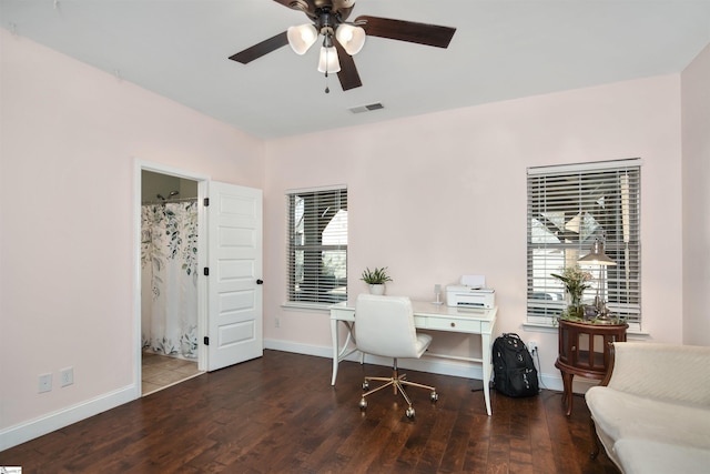 home office featuring dark hardwood / wood-style flooring, ceiling fan, and a healthy amount of sunlight