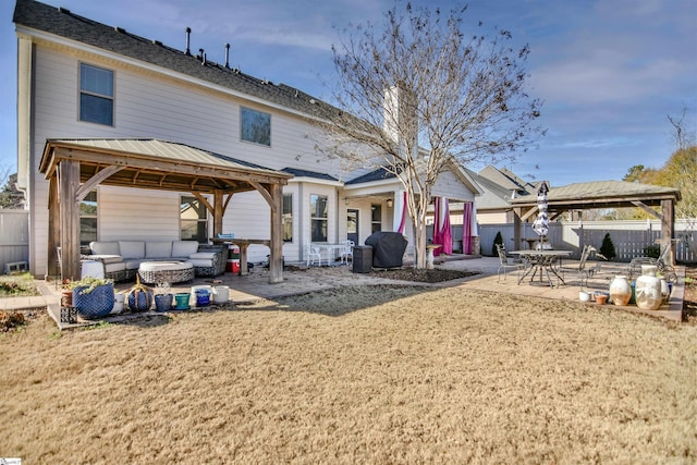 back of house featuring a gazebo, a patio area, and an outdoor hangout area