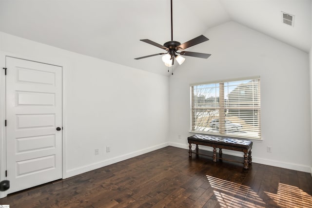 interior space featuring ceiling fan, dark wood-type flooring, and vaulted ceiling