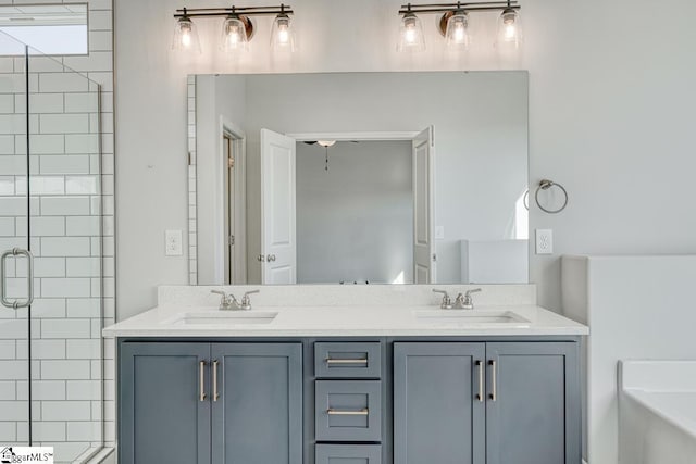 bathroom featuring vanity and independent shower and bath