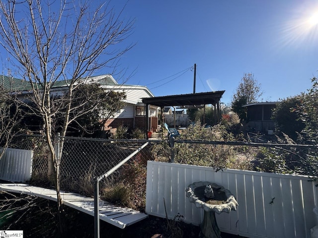 view of side of property with a carport