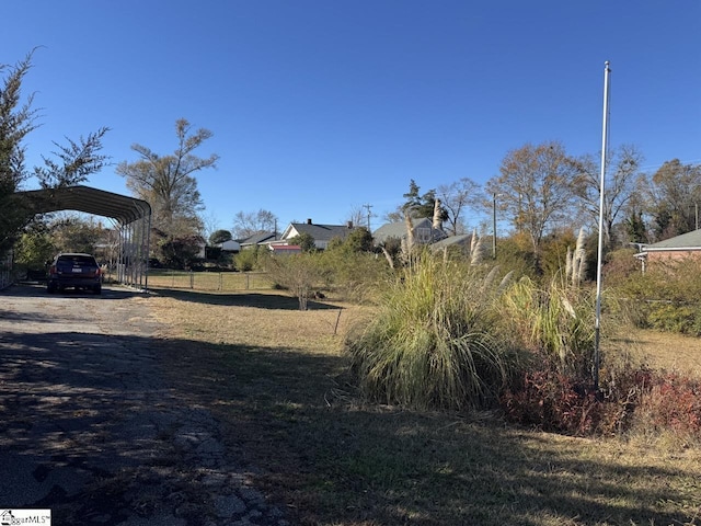 view of yard featuring a carport