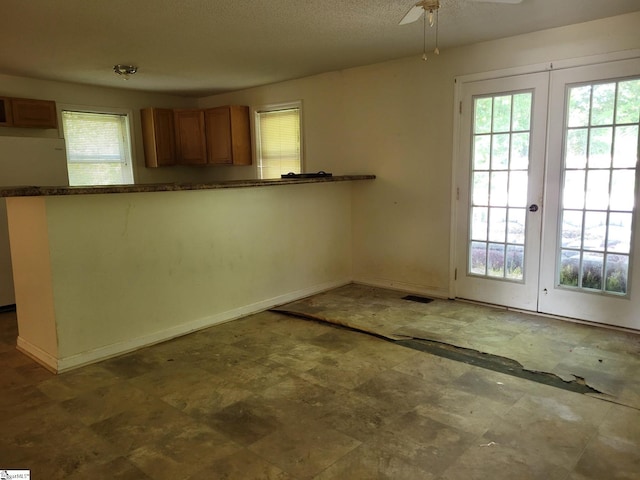 kitchen featuring ceiling fan, white refrigerator, kitchen peninsula, and french doors