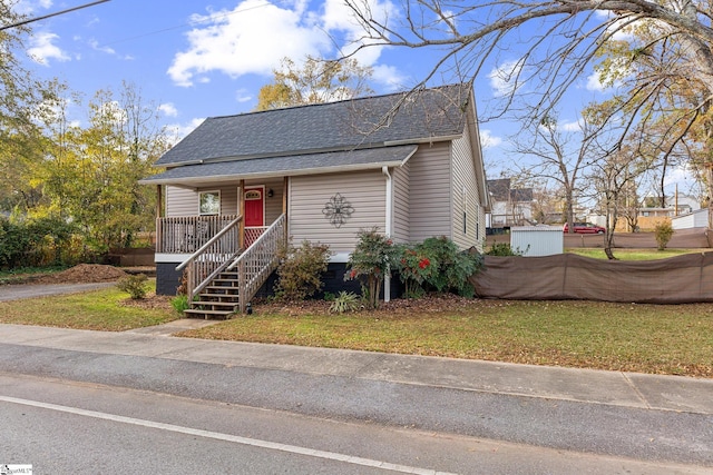 bungalow-style house featuring a front yard