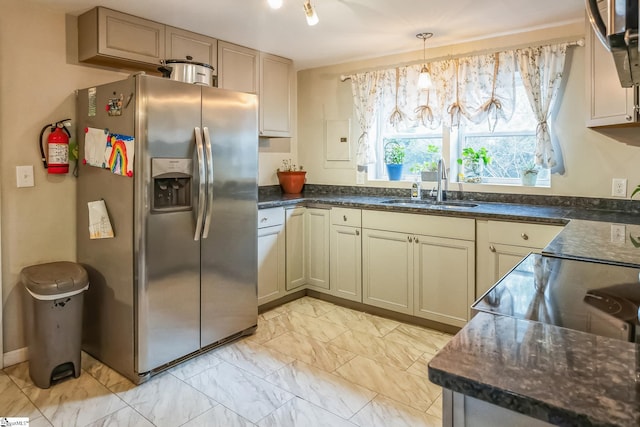 kitchen with pendant lighting, sink, and appliances with stainless steel finishes