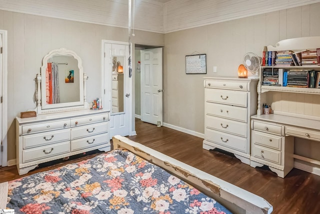 bedroom featuring dark hardwood / wood-style floors and ornamental molding