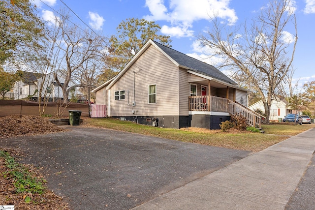 view of property exterior with a porch