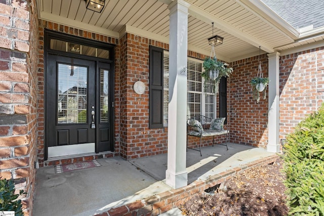 entrance to property featuring covered porch