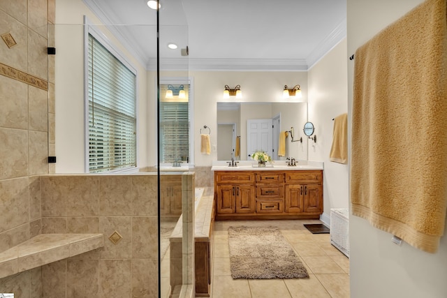 bathroom with vanity, crown molding, a shower, tile walls, and tile patterned flooring