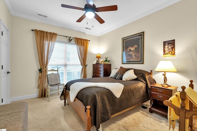 carpeted bedroom with ceiling fan and ornamental molding