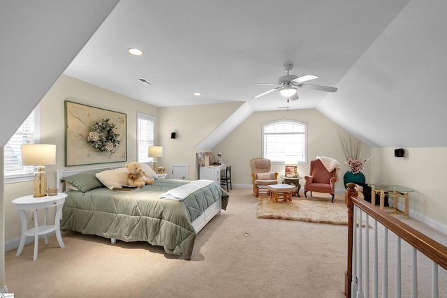 bedroom with light colored carpet, ceiling fan, and lofted ceiling