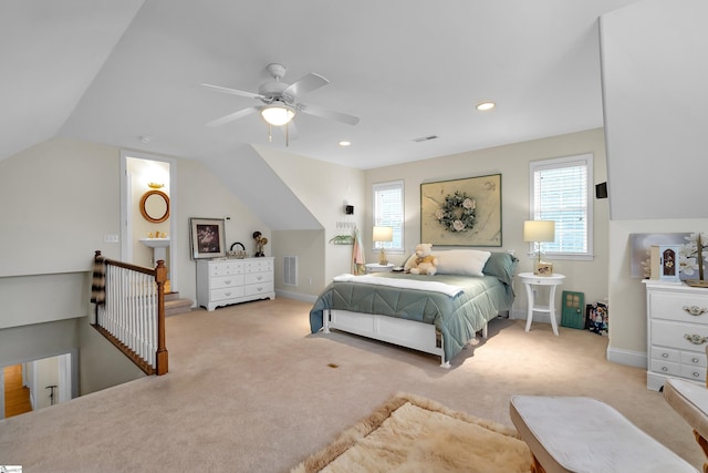 bedroom featuring ceiling fan, light carpet, and vaulted ceiling