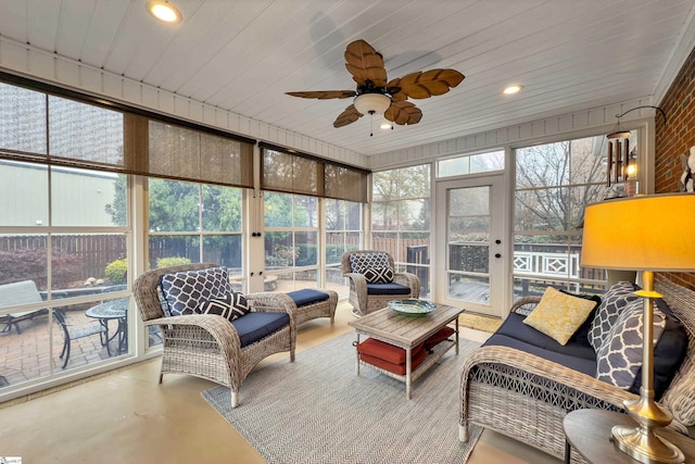 sunroom with ceiling fan and wood ceiling