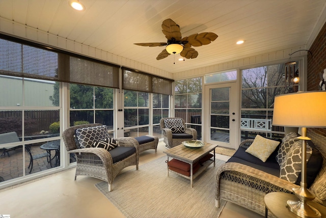 sunroom with ceiling fan and wood ceiling