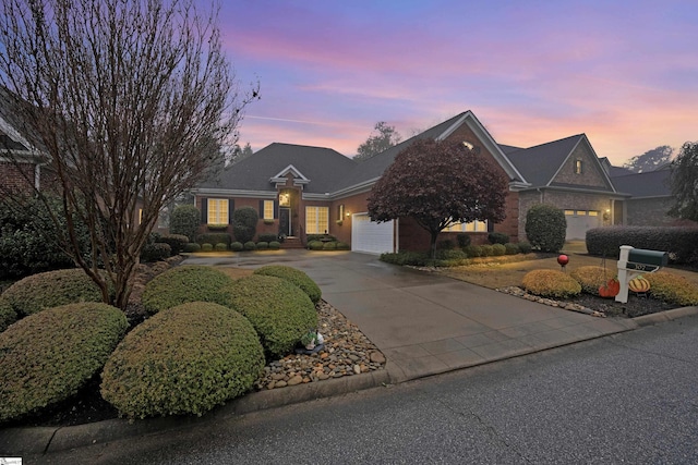 ranch-style home featuring a garage