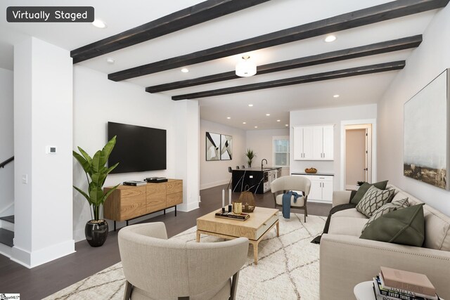 living room with beam ceiling, sink, and wood-type flooring